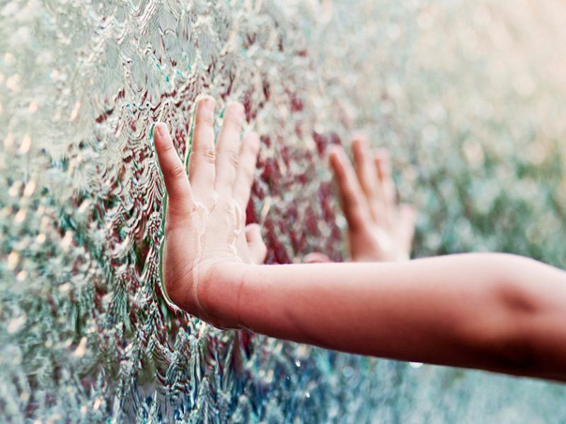 Child touching water