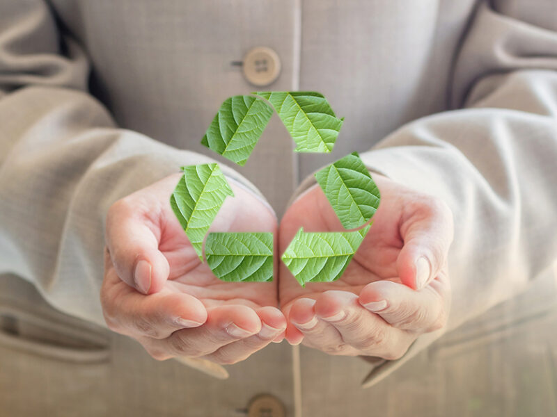 Man holding recycling symbol